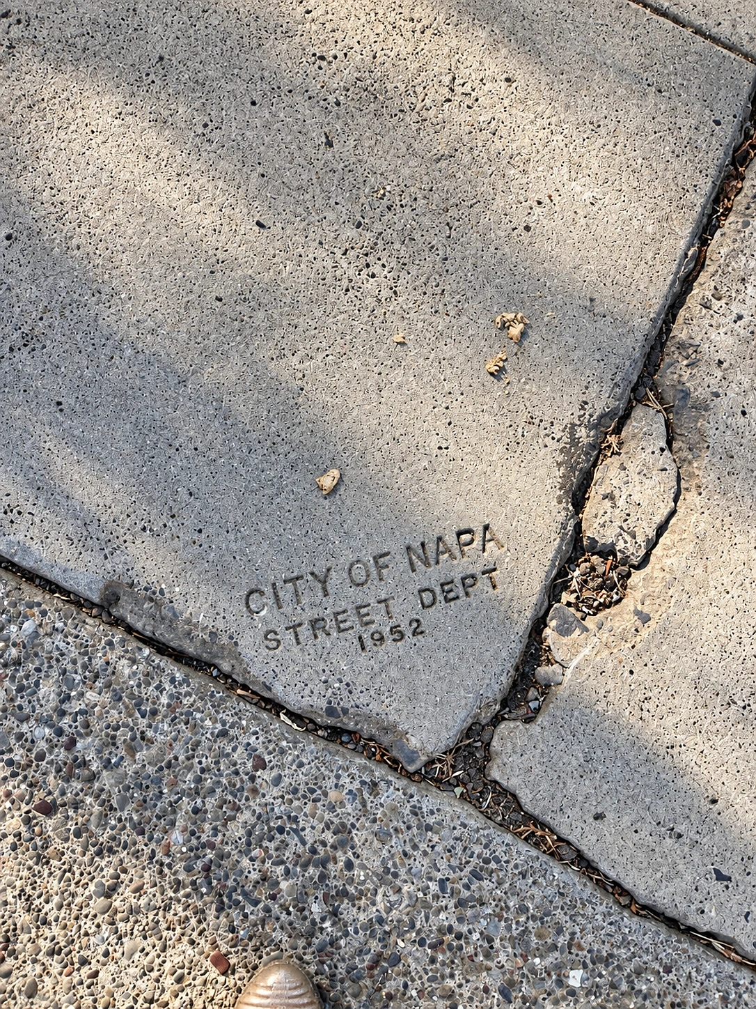 Sidewalk stamped 'City of Napa Street Dept 1952'